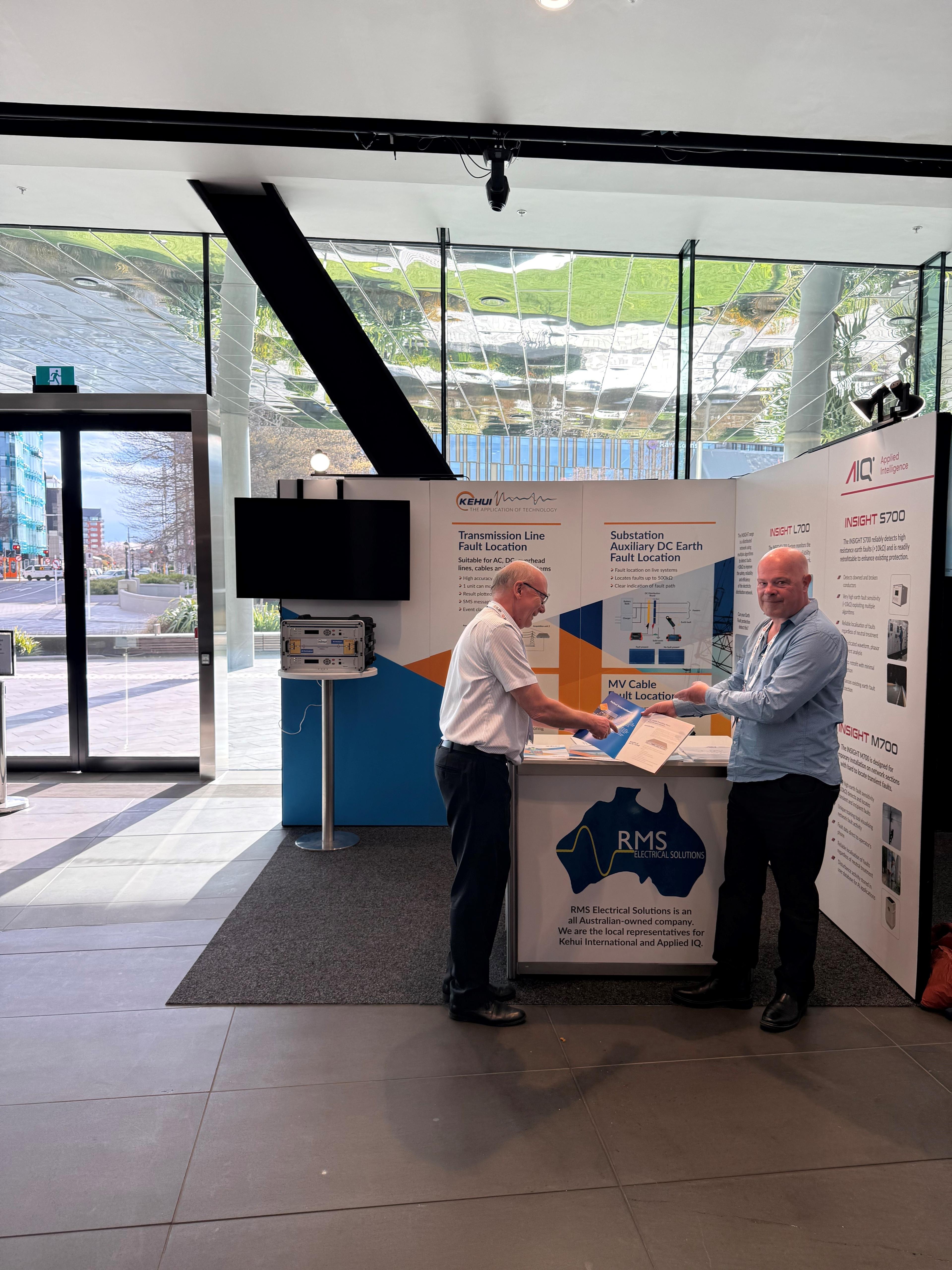 RMS Electrical Solutions and Kehui representatives at an industry trade show booth
