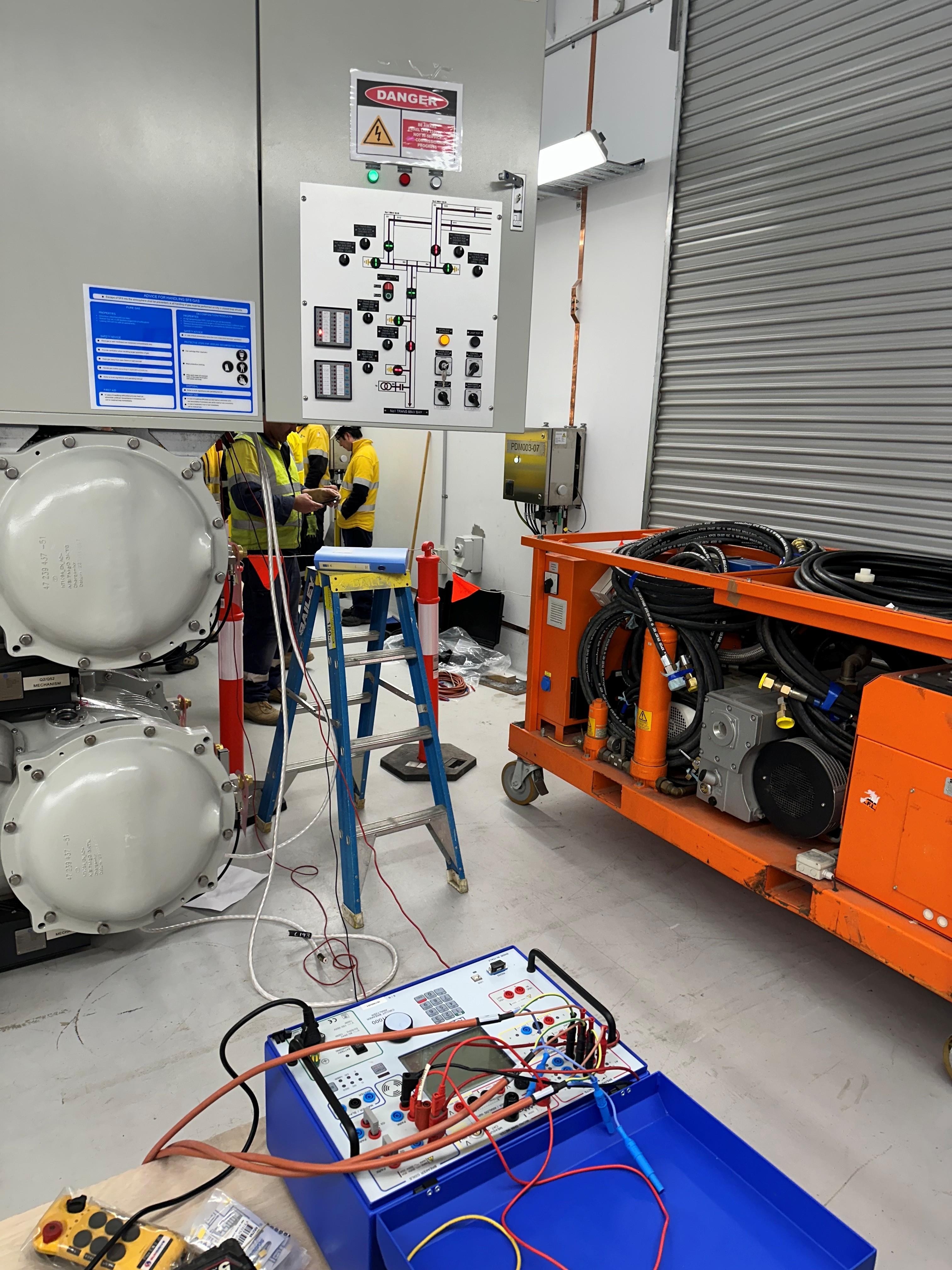 Portable protection relay test set in use at a substation switch room