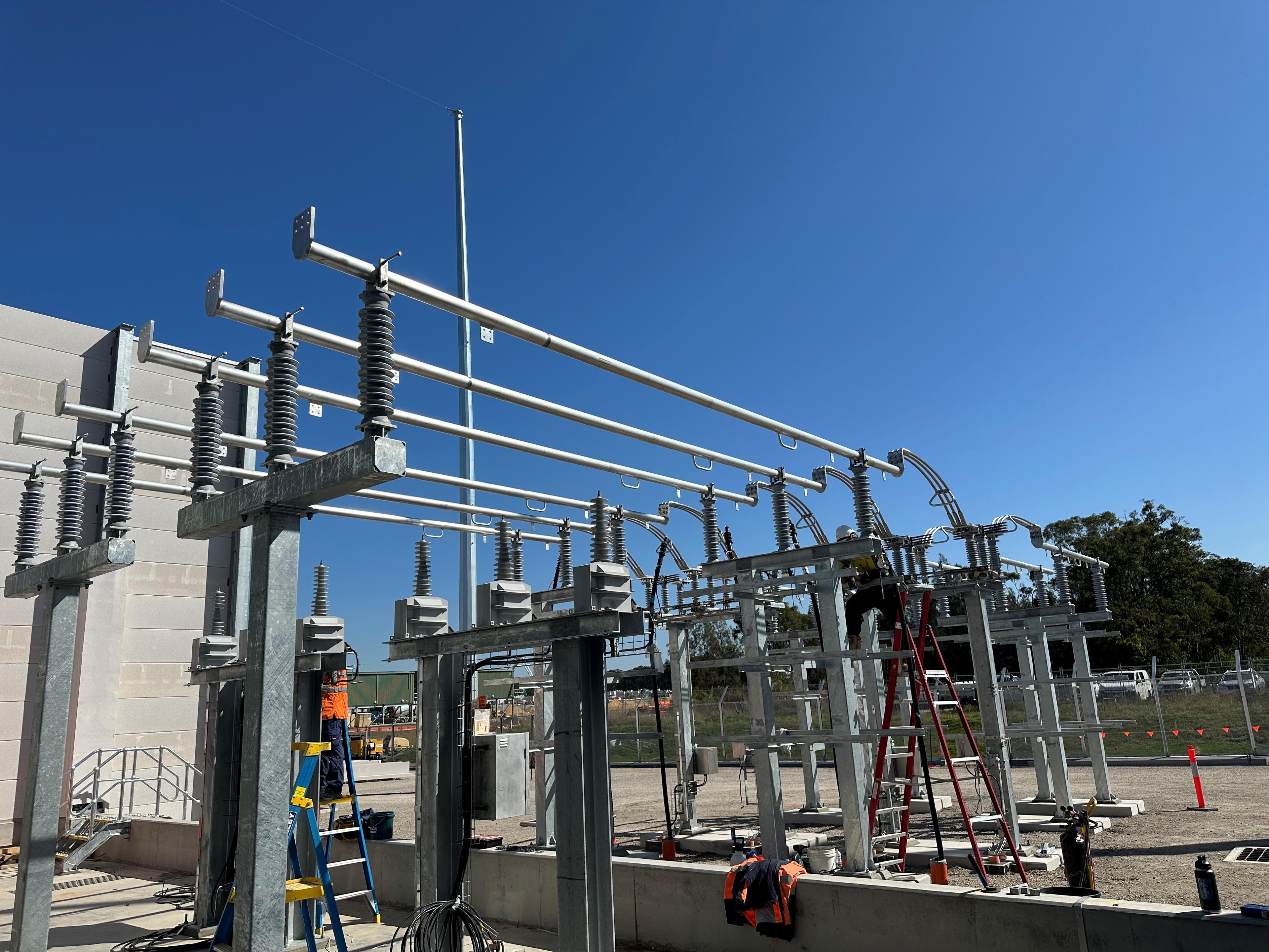 RMS Electrical Solutions engineer working on HV insulators at a substation